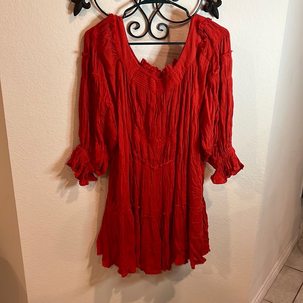 Free people burnt orange tunic  dress.  Has 3/4 sleeves and pockets!